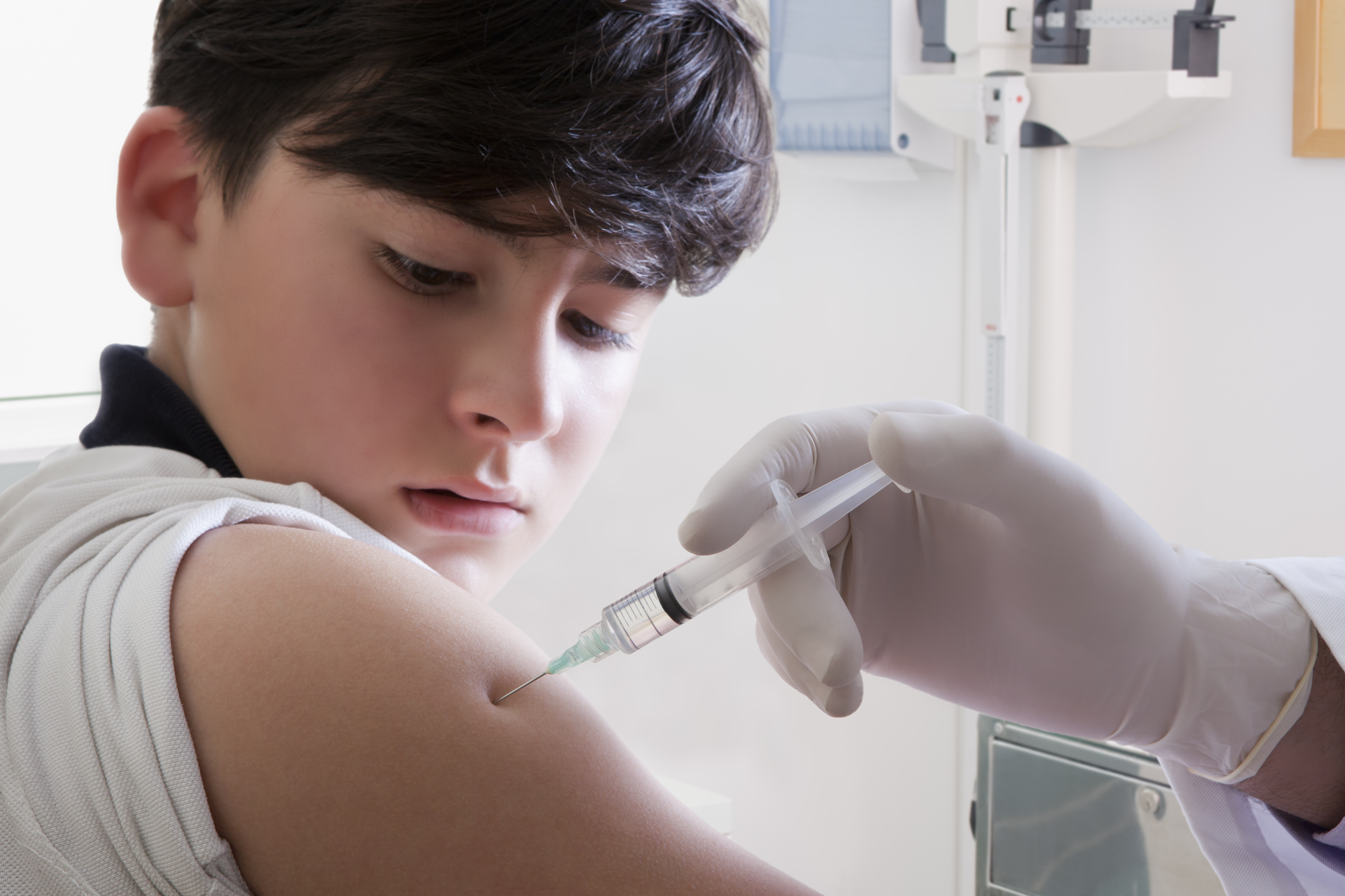 Teen boy getting vaccine