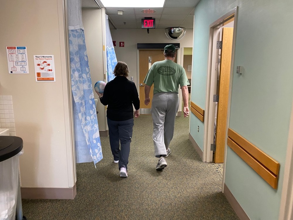 Mark Kitzelman works with specialty physical therapist Jodie Curran, PT, DPT, CLT-LANA, at the Amputee and Gait Rehab clinic at Methodist Hospital on April 26, 2022.
