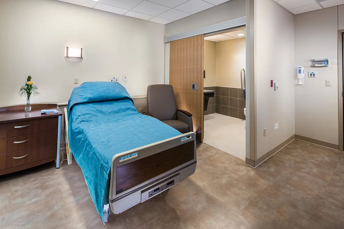 A private long-term care room and restroom at Dunklau Gardens.