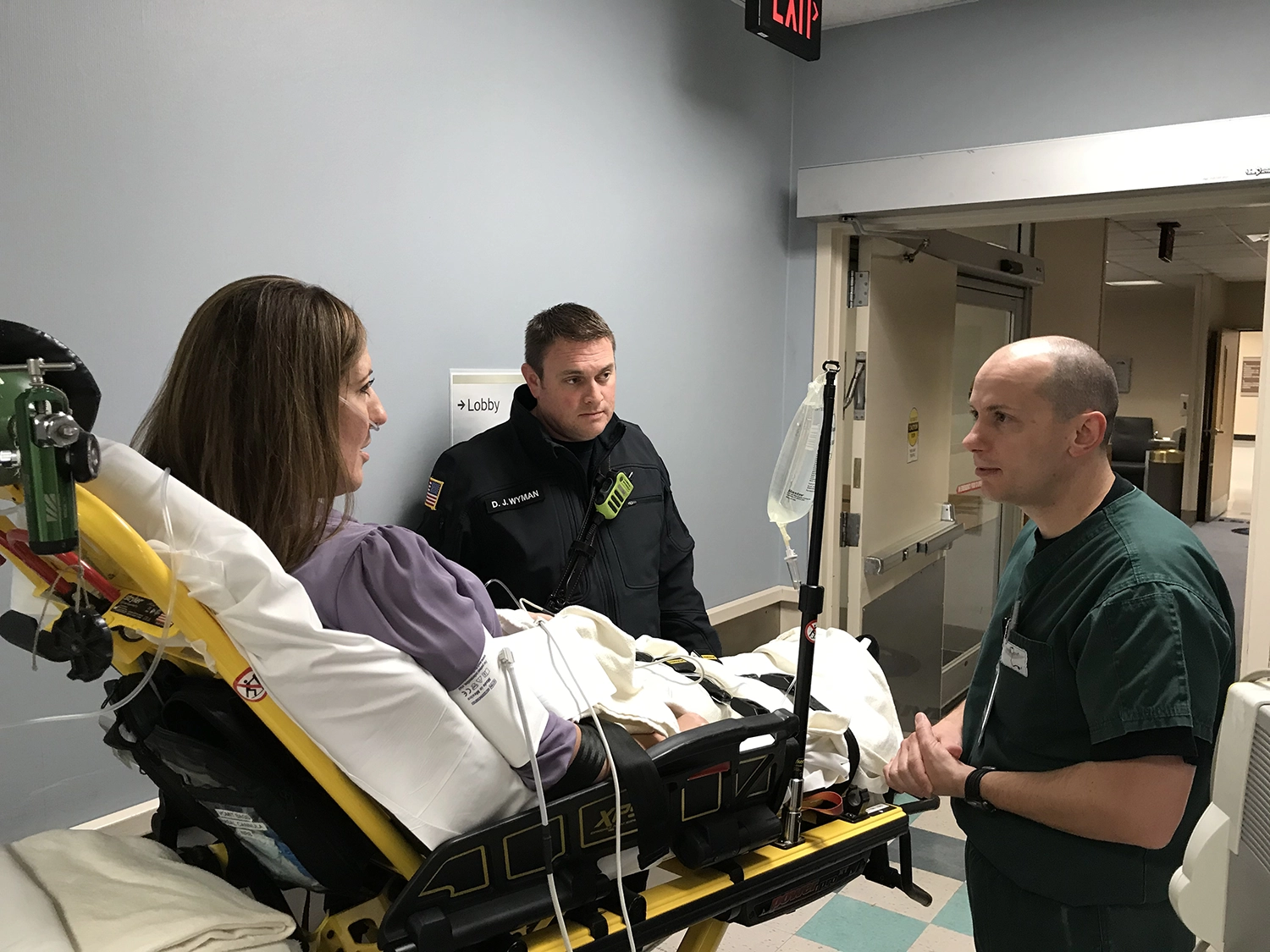 Dr. Frederick Raiser III assesses a stroke drill patient Tuesday.