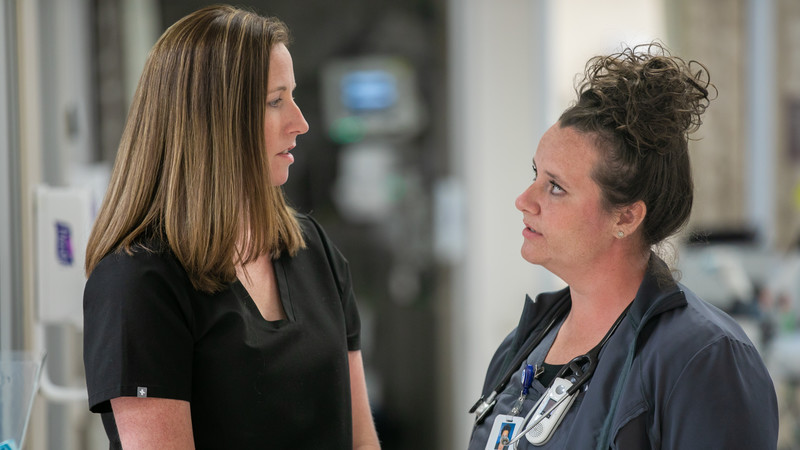 Laura Millemon, MD, a physician in the Methodist Hospital Emergency Department, consults with geriatric resource nurse Jessica Lock 