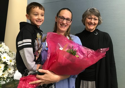 Maia Poutre, BSN, RNC-OB, C-EFM, with her mother, Pat Hoidal, and son Ben at a DAISY Award ceremony