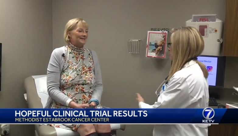 Image of patient and provider talking in patient room from KETV News story
