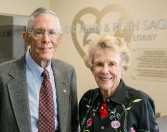 Photo of Dr. John and Ruth Sage standing in the lobby of Kountze Commons in Omaha, Nebraska