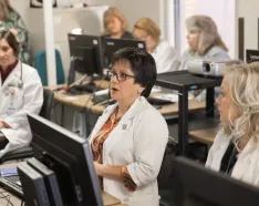 Photo of medical providers discussing an issue