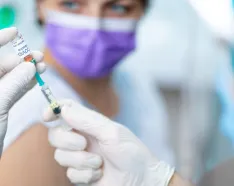 Woman getting COVID-19 vaccine