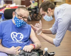 Dunklau Gardens resident receiving vaccine