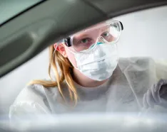 Nursing conducting COVID-19 test