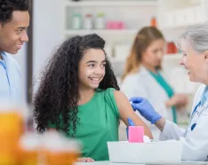 Preteen getting vaccinated