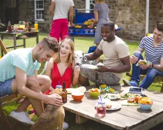 Group of friends at outdoor barbecue