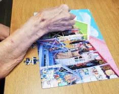 Lila Day working on a puzzle