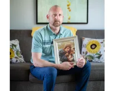 Matt Cooper with a photo of his mother, Michele
