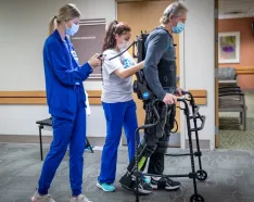 Alan Borgmann uses the EksoNR robotic exoskeleton