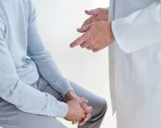 Man visiting male doctor