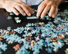 Older man working on puzzle