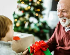 Senior aged man receiving gift