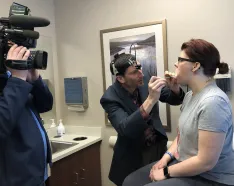 Head and Neck Oncologist Dr. Lindau performing a head and neck cancer screening at Methodist Estabrook Cancer Center