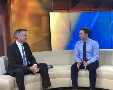 Pediatrician Dr. Matthew Gibson being interviewed by KETV's Rob McCartney