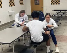 NMC students perform sports physicals at Burke High School