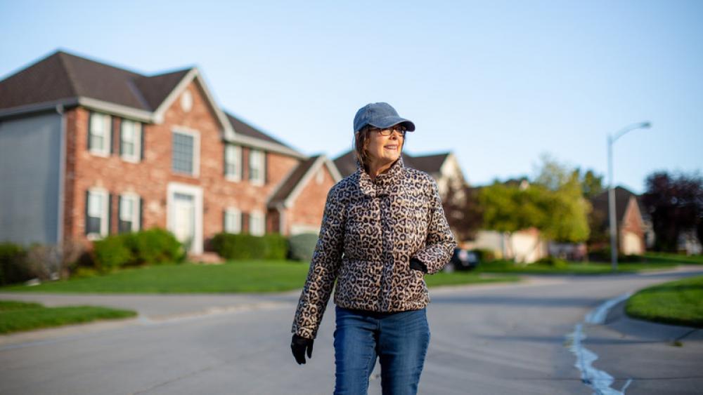 LeAnna MacDonald walking through a local neighborhood