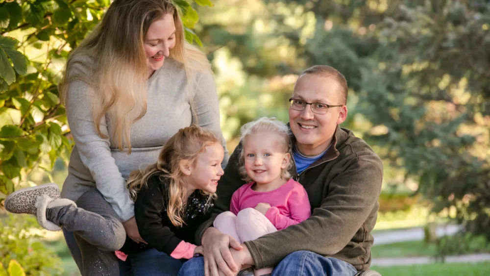 Mike Lambert with his wife and daughters
