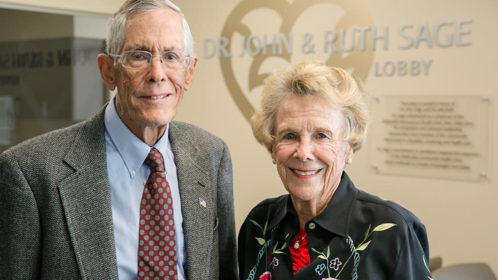 Photo of Dr. John and Ruth Sage standing in the lobby of Kountze Commons in Omaha, Nebraska