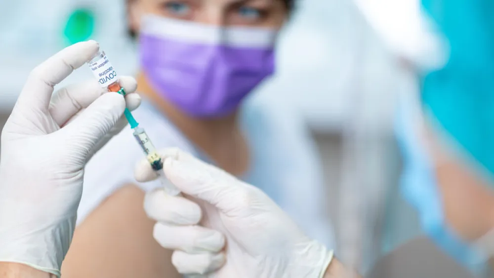Woman getting COVID-19 vaccine