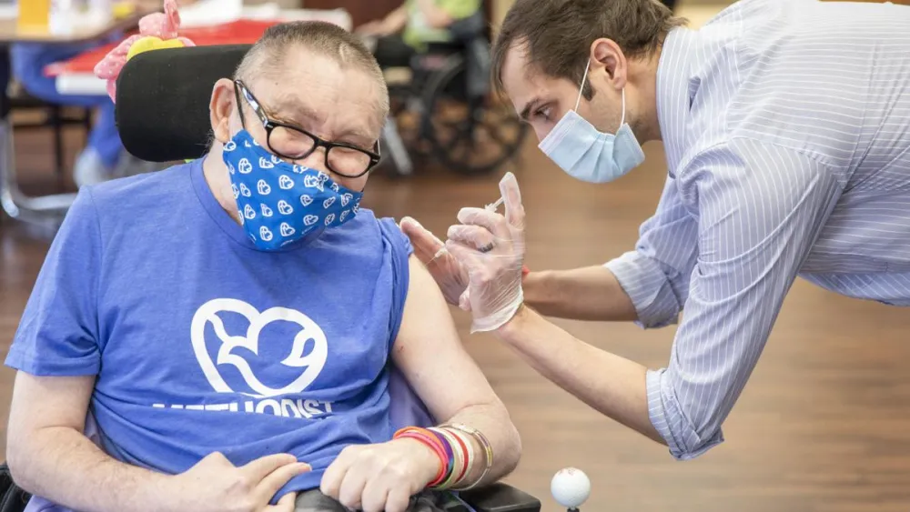 Dunklau Gardens resident receiving vaccine