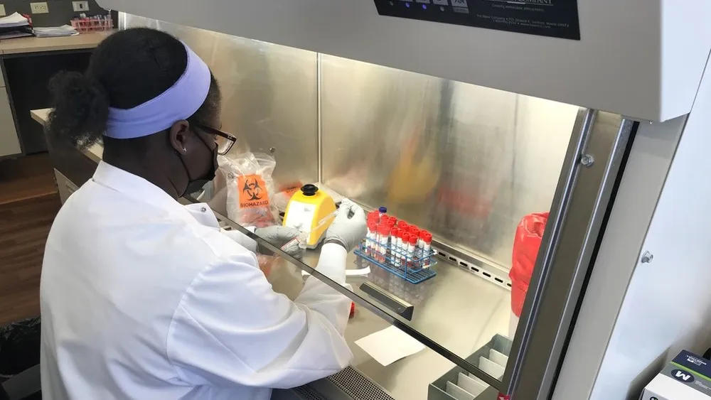Medical technologist Christine Juma, MLS(ASCP)CM, prepares a COVID-19 test at the Methodist Pathology Center-Schenken Pavilion on March 19, 2021.