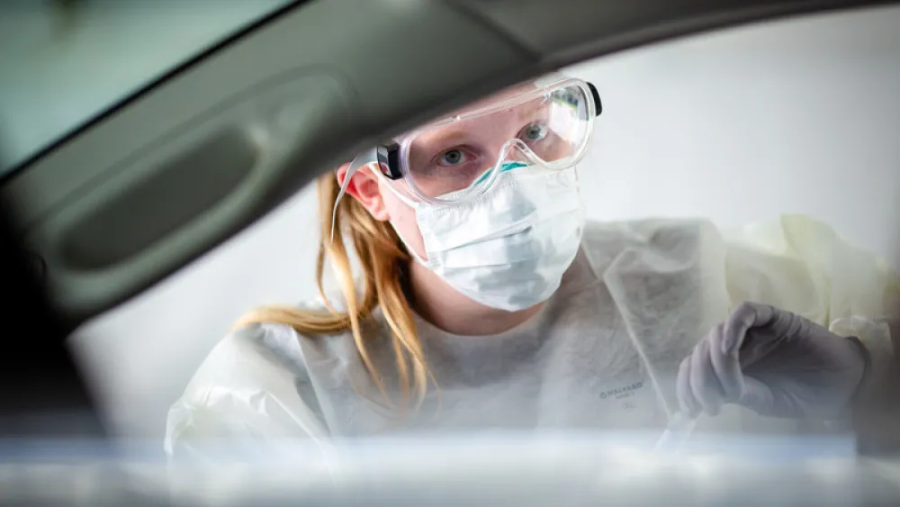 Nursing conducting COVID-19 test