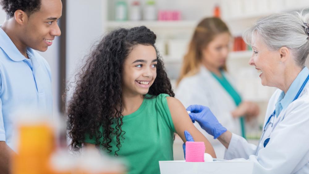 Preteen getting vaccinated