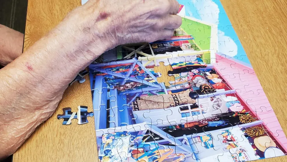 Lila Day working on a puzzle