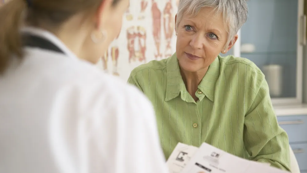 Older woman with doctor