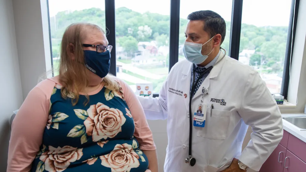 Sarah Drummond with pulmonologist Sumit Mukherjee, MD