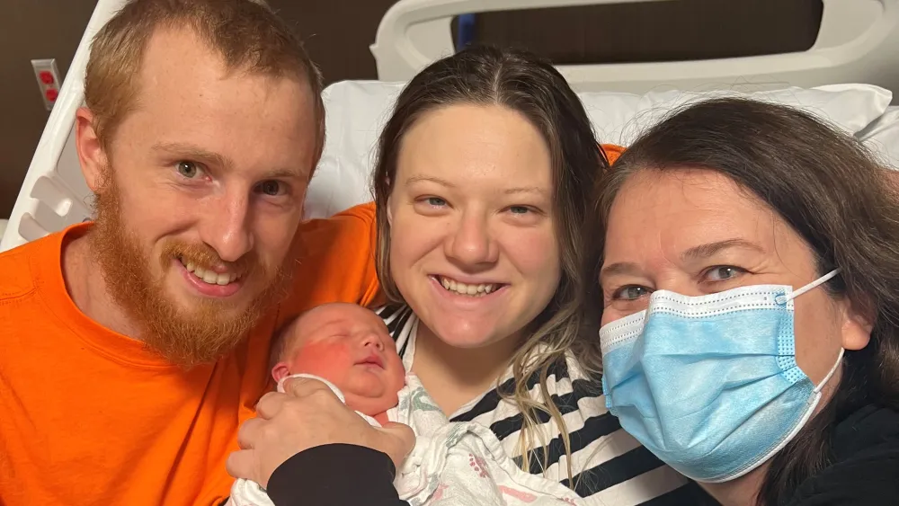 Silas Paul Williams with parents Chelsea and Elijah Williams and Dr. Maureen Boyle