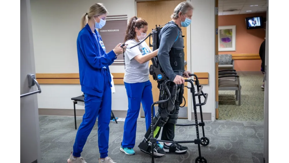 Alan Borgmann uses the EksoNR robotic exoskeleton