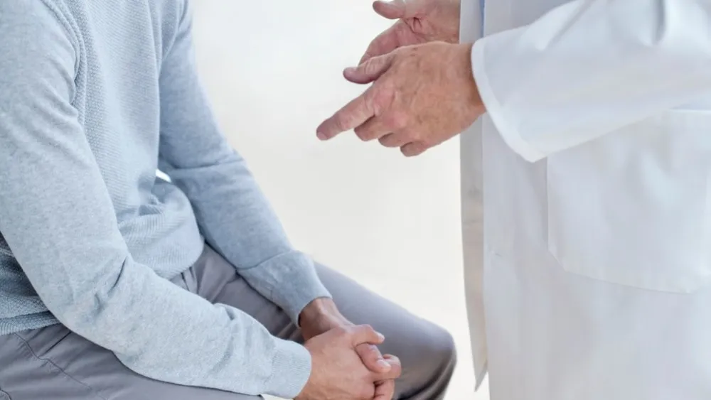 Man visiting male doctor