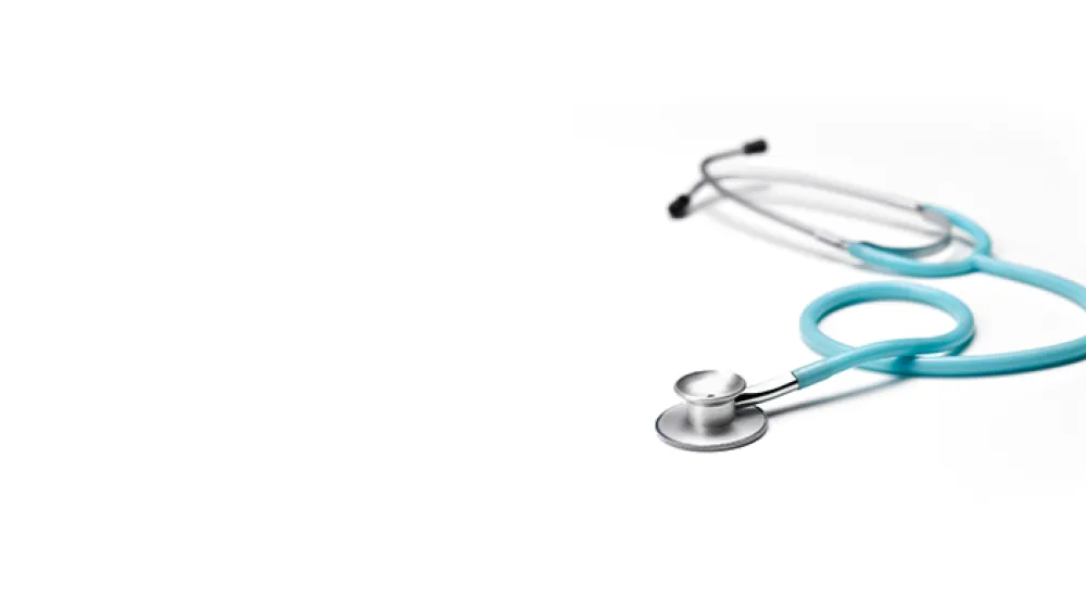 image of a light blue stethoscope on a white background