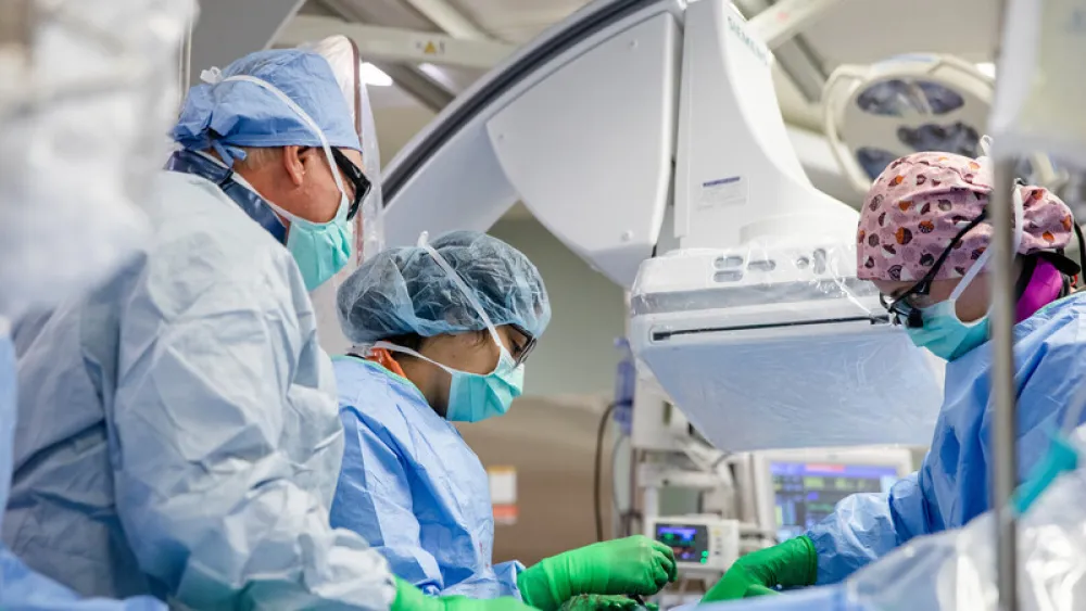 Dr. Madan, Dr. Merritt and Dr. Olson perform TAVR