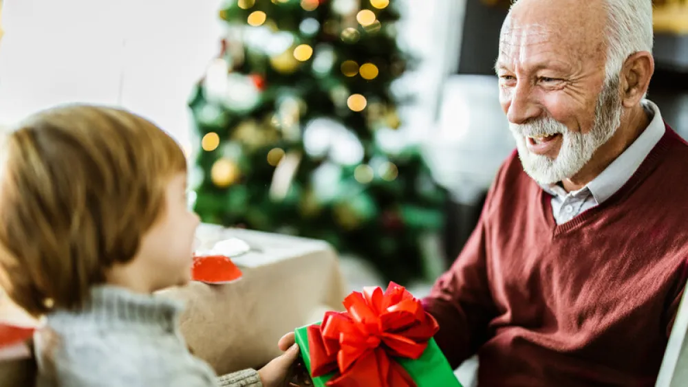 Senior aged man receiving gift