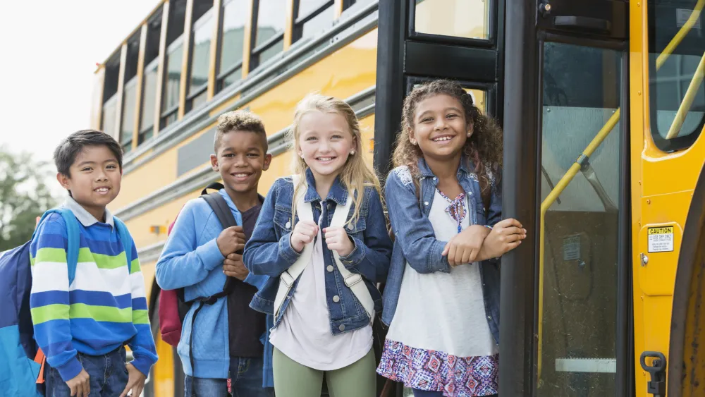 Kids getting on school bus