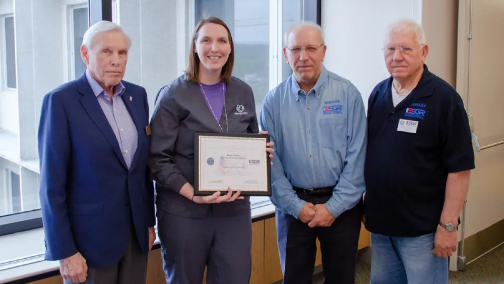 Image for post: 'A Rare Gift for a Supervisor': Service Leader Honored for Supporting Deployed Nurse 