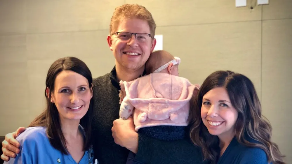 Image for post: Nurse Receives The DAISY Award for Coaching Couple Through Pregnancy Loss, Births of Daughters 