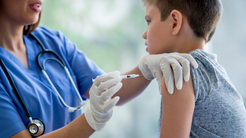Photo of child getting an Influenza Shot