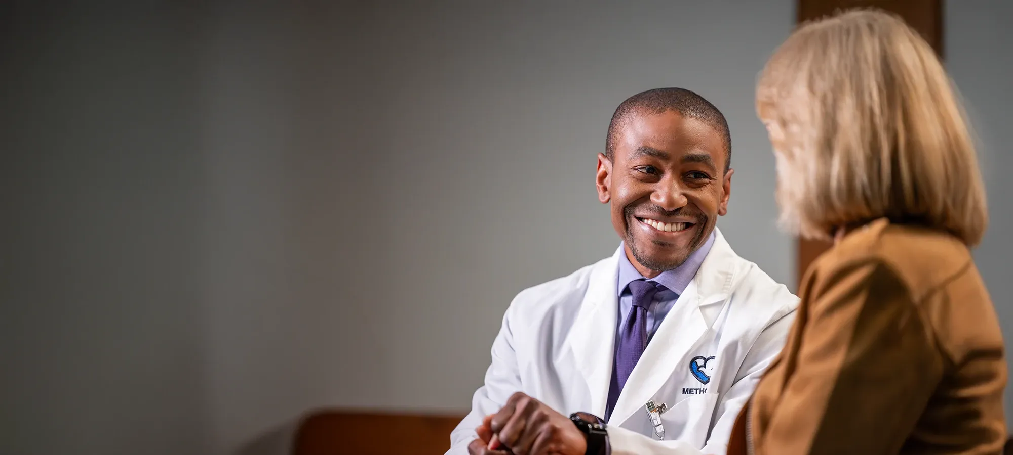Photo of Dr. Glynne Edwards with a patient