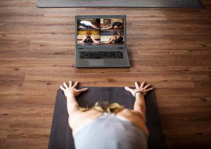 woman doing virtual yoga