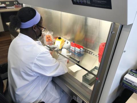Medical technologist Christine Juma, MLS(ASCP)CM, prepares a COVID-19 test at the Methodist Pathology Center-Schenken Pavilion on March 19, 2021.
