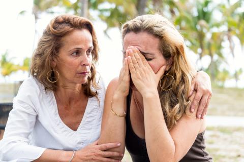 Woman consoling friend