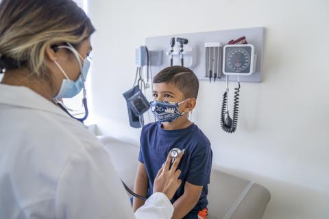 Young boy visiting doctor