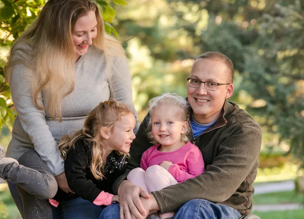 Mike Lambert with his wife and daughters
